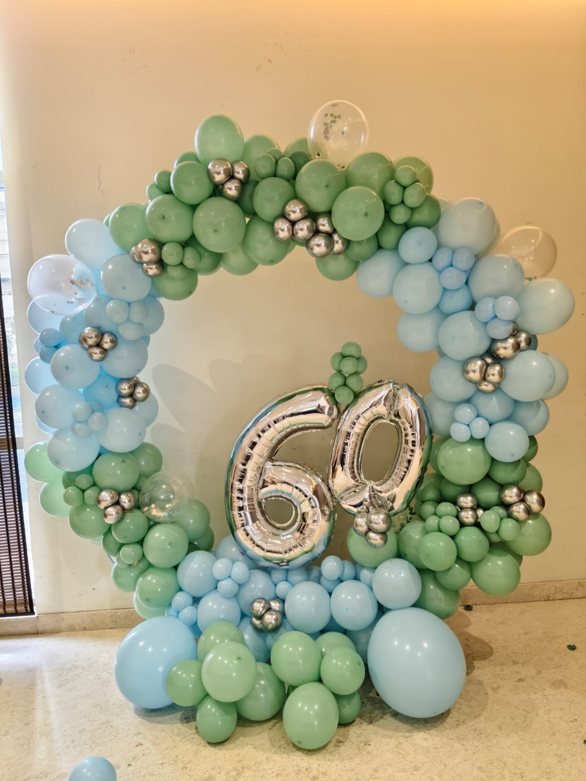 Sage Green & Chrome 60th Milestone Ring Arch balloon decoration inspiration